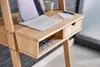 A close-up view of a wooden desk with a laptop, a cup, and a notebook. Voir les images du produit