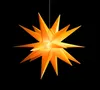 A 3D star-shaped lamp is suspended against a black background. Produktbild-Vorschau
