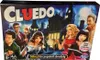 The image shows the box of the board game Cluedo, with characters depicted on the front. Podgląd zdjęcia produktu