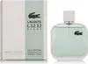 A bottle of Lacoste Eau De Lacoste L.12.12 Blanc Eau Fraîche Eau de Toilette for men and its packaging are displayed against a white background. Podgląd zdjęcia produktu