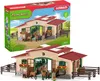 A toy farm stable set with horses and accessories, shown both in its packaging and as a standalone product. Produktbild-Vorschau