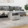 A modern living room scene with a gray sofa, a concrete-effect coffee table, and a rug. Produktbild-Vorschau