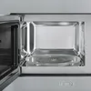 Close-up view of the interior of a Smeg microwave oven, showing the turntable and the metallic interior. Produktbild-Vorschau