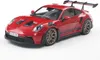 A red Porsche 911 GT3 RS model car is displayed on a white background. Produktbild-Vorschau