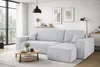 A modern living room with a light gray sectional sofa, a round coffee table, and artwork on the wall. Produktbild-Vorschau