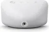 A white Amazon Echo Show 5 (3rd Gen) smart display is shown from a slightly elevated front-left angle, with its power port visible on the bottom. Produktbild-Vorschau