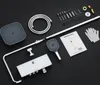A flat lay of a shower fixture set and its components, including a shower head, hose, control panel, and installation instructions, arranged on a black background. Podgląd zdjęcia produktu