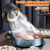 A portable kitchen exhaust fan is shown in use, venting smoke from a hot pot on a table. Produktbild-Vorschau
