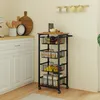A kitchen scene with a rolling cart filled with produce and jars, next to white kitchen cabinets. Podgląd zdjęcia produktu