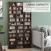 A tall, brown CD/DVD storage shelf filled with CDs is shown next to a gray sofa in a room with a green wall. Produktbild-Vorschau