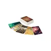 A stack of cards and several cards spread out in front of it. Anteprima dell’immagine prodotto
