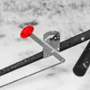 A close-up of a red handle and a silver measuring device on a black bar, with a snowy background. Produktbild-Vorschau