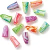 A collection of colorful, marbled earplugs scattered on a white background. Produktbild-Vorschau