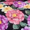 A close-up view of a floral pattern on fabric. Produktbild-Vorschau