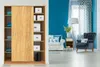 A living room scene with a wardrobe and furniture. Voir les images du produit