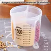 A transparent plastic food storage container with multiple compartments filled with grains and nuts, placed on a patterned cloth. Produktbild-Vorschau
