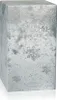 A silver-colored perfume bottle with snowflake and speckled patterns. Voir les images du produit