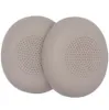 Two beige ear pads for headphones are shown on a white background. Voir les images du produit