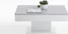 A modern coffee table with a concrete-look top and white base, decorated with two small potted plants and an open book. Podgląd zdjęcia produktu