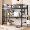 A loft bed with a desk and shelves is set up in a room with a wooden paneled wall. Produktbild-Vorschau
