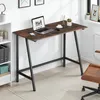 A desk with a laptop and small potted plants in an office setting. Produktbild-Vorschau