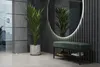 A modern entryway with a green upholstered bench with a shoe rack underneath, a large oval mirror with LED lighting, and a potted plant. Náhled obrázku produktu