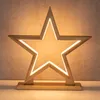 A wooden star-shaped lamp with LED lights. Produktbild-Vorschau