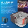 A cutaway view of an inflatable hot tub, with people enjoying another hot tub in the background, and marketing text highlighting energy efficiency. Produktbild-Vorschau