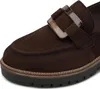 A close-up view of a brown suede loafer with a decorative buckle. Produktbild-Vorschau
