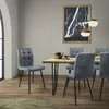 A dining room scene with a table and chairs. Náhled obrázku produktu