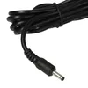 A close-up shot of a black power cord with a silver connector tip. Produktbild-Vorschau