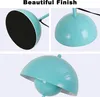Collage of close-up shots of a turquoise lamp base and shade. Voir les images du produit