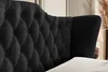 Close-up of a black tufted headboard of a bed. Produktbild-Vorschau
