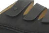 Close-up of a dark grey sandal with three adjustable straps. Produktbild-Vorschau