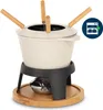 A fondue set on a wooden base with a burner underneath. Voir les images du produit
