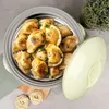A food container filled with dumplings, with a lid next to it and some pasta on the side. Produktbild-Vorschau