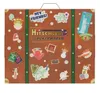 A suitcase-shaped advent calendar decorated with travel-themed stickers and the brand name. Produktbild-Vorschau