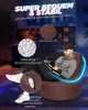A man is sitting on a brown beanbag chair in a dimly lit room with gaming equipment in the background. Produktbild-Vorschau