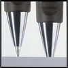 Close-up of two pen tips touching a surface. Anteprima dell’immagine prodotto
