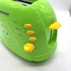 Close-up of a green toaster with yellow buttons and lever. Produktbild-Vorschau