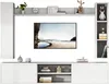 A modern living room wall unit with a TV, shelves, and decorative items. Produktbild-Vorschau