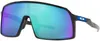 A pair of Oakley Sutro sunglasses with a black frame and a mirrored lens reflecting blue, green, and purple colors. Náhled obrázku produktu