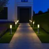 A pathway illuminated by bollard lights leads to a modern house entrance at dusk. Náhľad obrázku produktu
