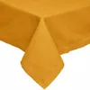 A close-up view of a mustard yellow tablecloth, showing the corner and a fold. Anteprima dell’immagine prodotto
