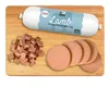A dog treat product displayed on a wooden cutting board with sliced and diced portions. Podgląd zdjęcia produktu