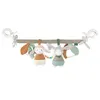 A baby stroller chain with two plush toys and various sensory elements. Produktbild-Vorschau
