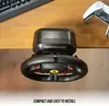 A gaming steering wheel is clamped to the edge of a wooden desk, with a keyboard and a game controller visible in the background. Produktbild-Vorschau