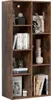 A bookshelf filled with decorative items and books. Náhľad obrázku produktu