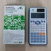 A scientific calculator and its packaging are displayed side-by-side on a light gray surface. Podgląd zdjęcia produktu