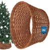 A Christmas tree with ornaments and a wicker tree skirt. Náhľad obrázku produktu